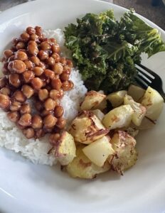 bowl of rice, roasted potatoes, bbq chickpeas and kale